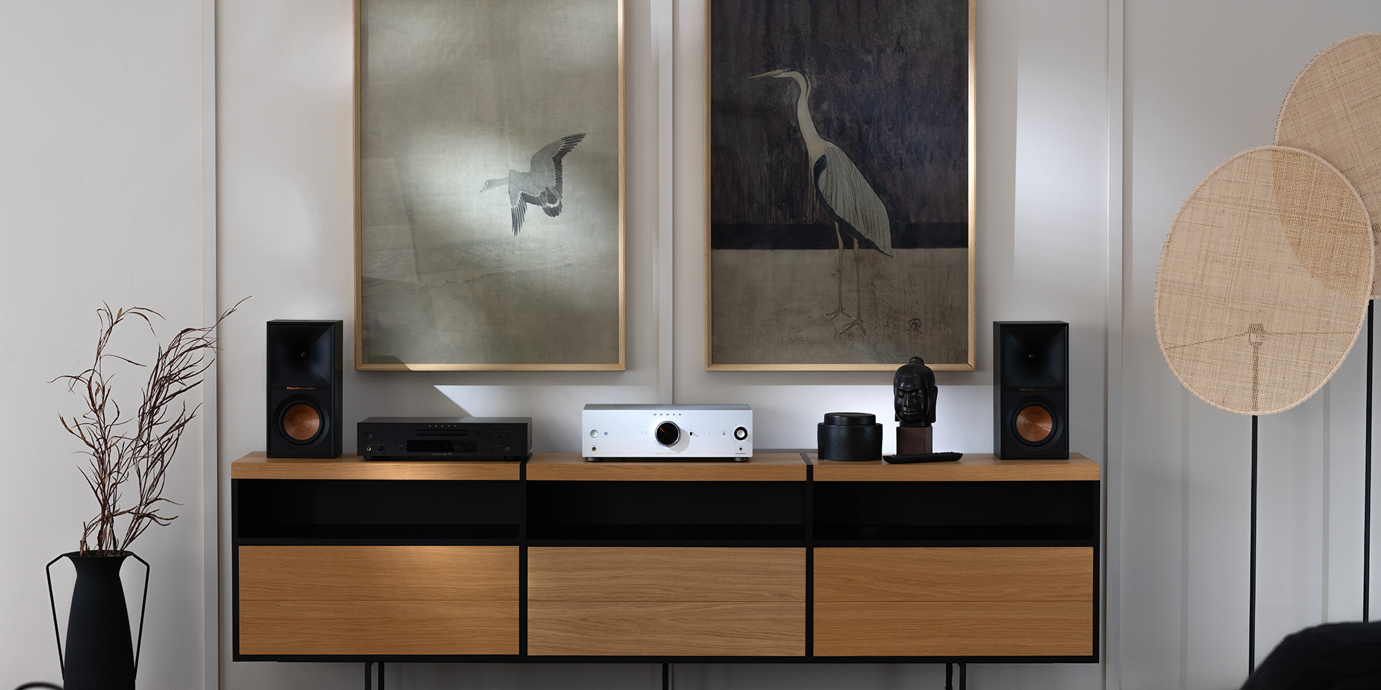 Onkyo Icon A 50 and C 30 Silver and Klipsch bookshelf speakers on media console with crane art on wall behind 2000x1000