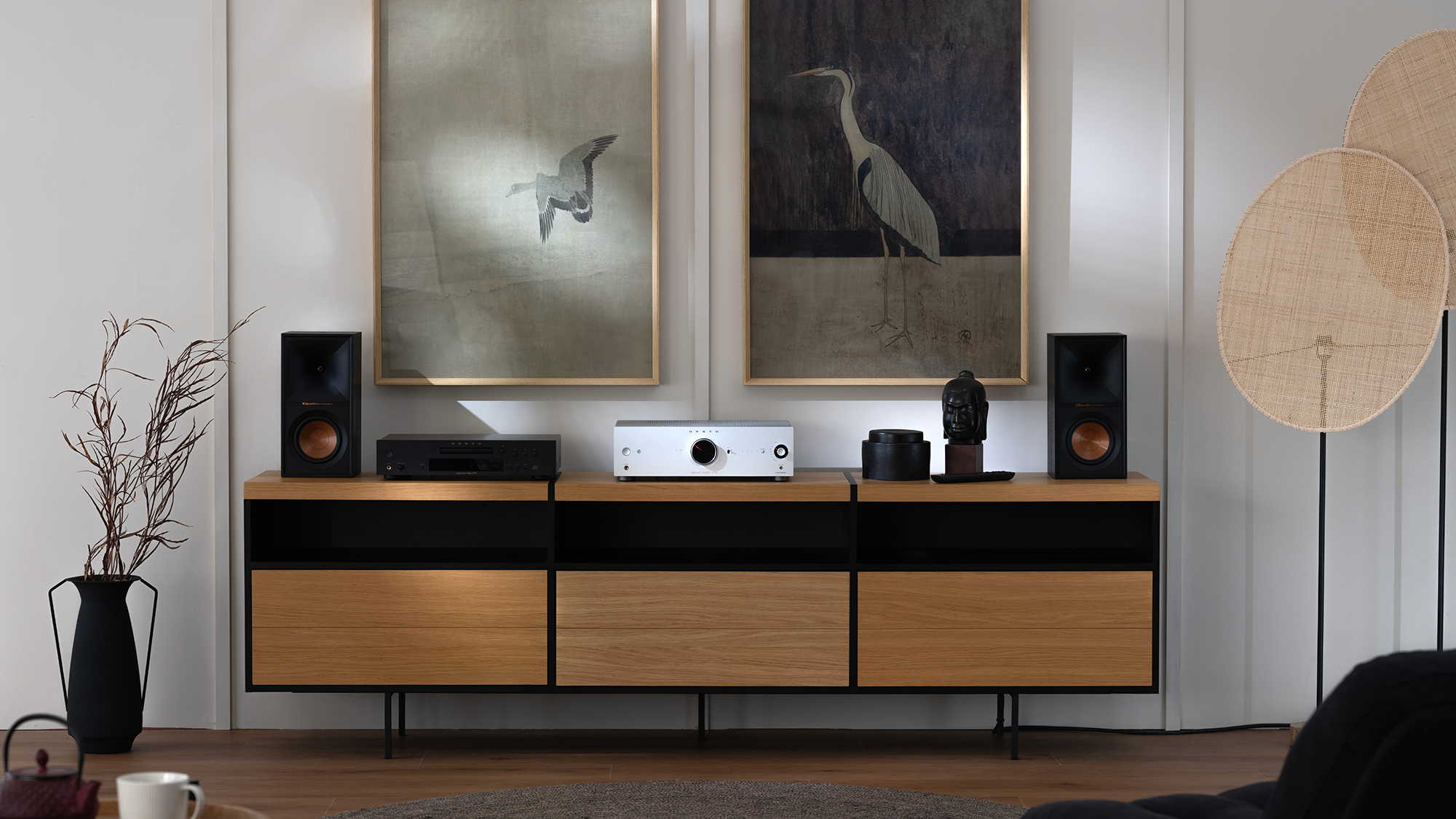 Onkyo Icon A 50 and C 30 Silver and Klipsch bookshelf speakers on media console with crane art on wall behind 2000x1333