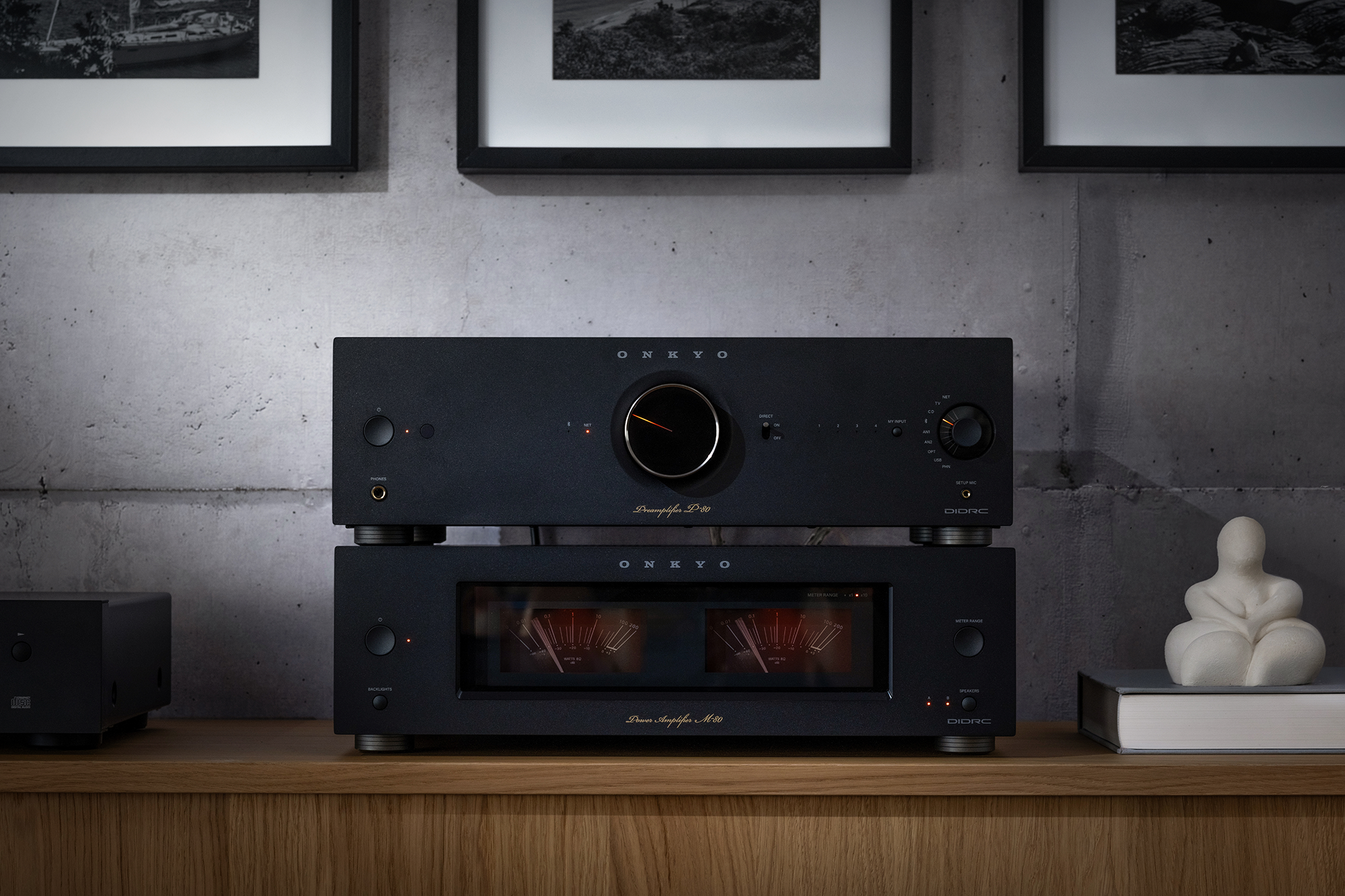 Onkyo Icon P 80 and M 80 black stacked beside small marble sculpture in listening room 2000x1333